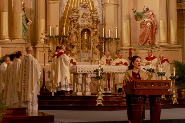 Priests and other church leaders leading mass.