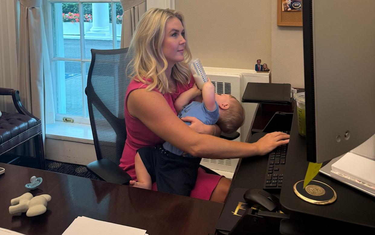 Karoline Leavitt feeds her son while working in the White House